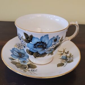 Blue Floral Porcelain Teacup and Saucer with Gold Trim